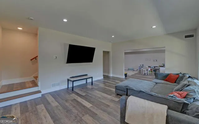 a workspace with furniture and wooden floor