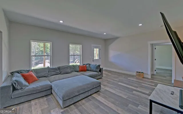 a living room with furniture and a table