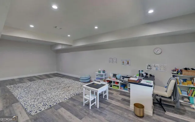 a view of a livingroom with wooden floor