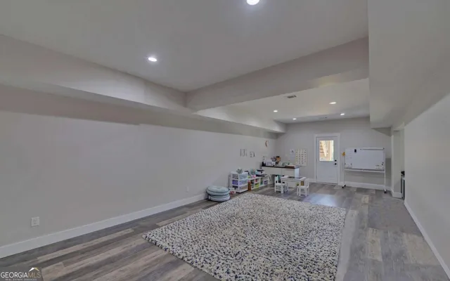 a bathroom with a sink vanity mirror and toilet