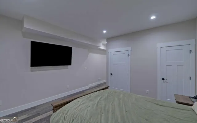 a spacious bedroom with two beds and a couch