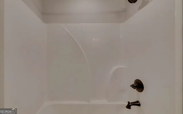 a bathroom with a sink double vanity and a mirror