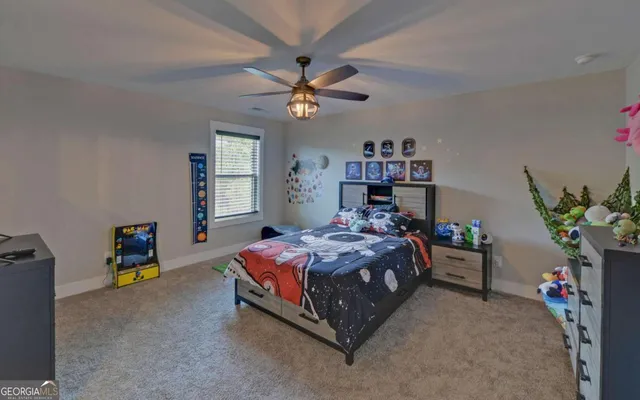 a bedroom with a bed and a tv