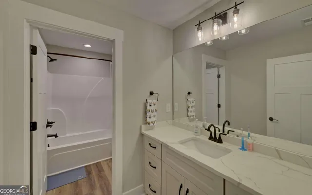 a view of walk in closet with clothes