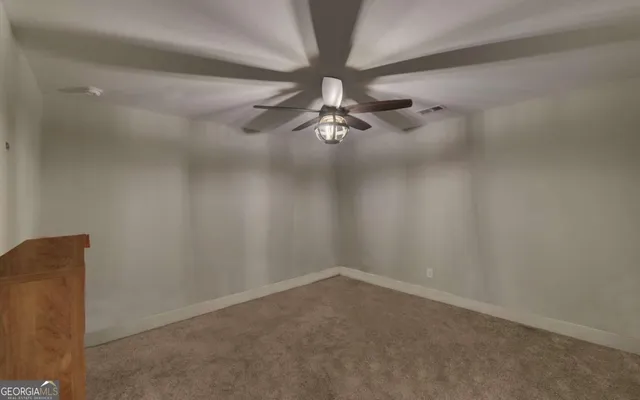 a view of a balcony with wooden fence