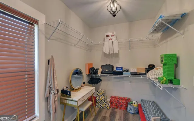 a balcony with furniture and a garden