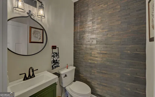 a view of a yard with plants and trees