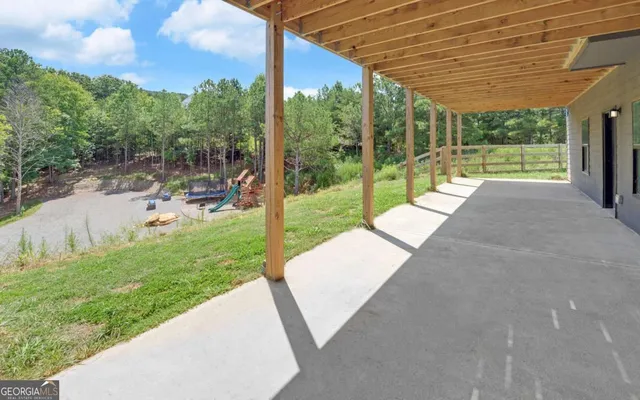a view of swimming pool with a yard