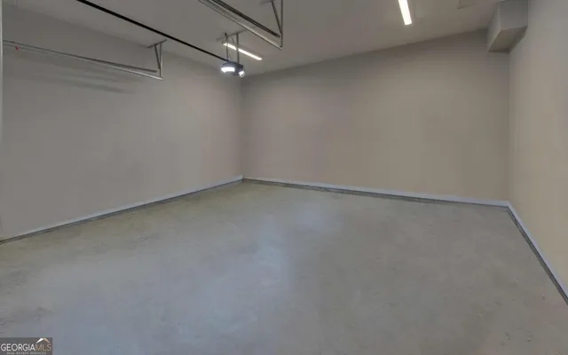 an aerial view of a house with a garden and swimming pool