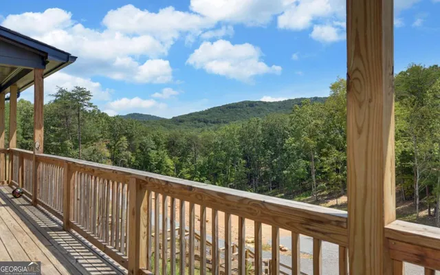an aerial view of a house with garden space and street view