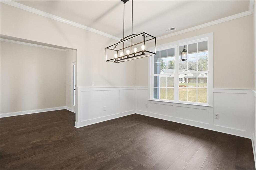 2013 Seclusion Trail Monroe, GA 30656 - Photo 14 of 63 a view of a room with wooden floor closet and windows