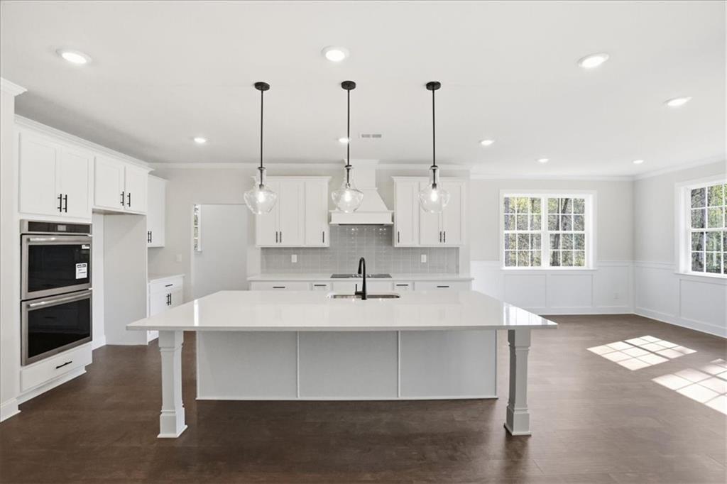 2013 Seclusion Trail Monroe, GA 30656 - Photo 16 of 63 a view of kitchen with kitchen island a sink stainless steel appliances and window
