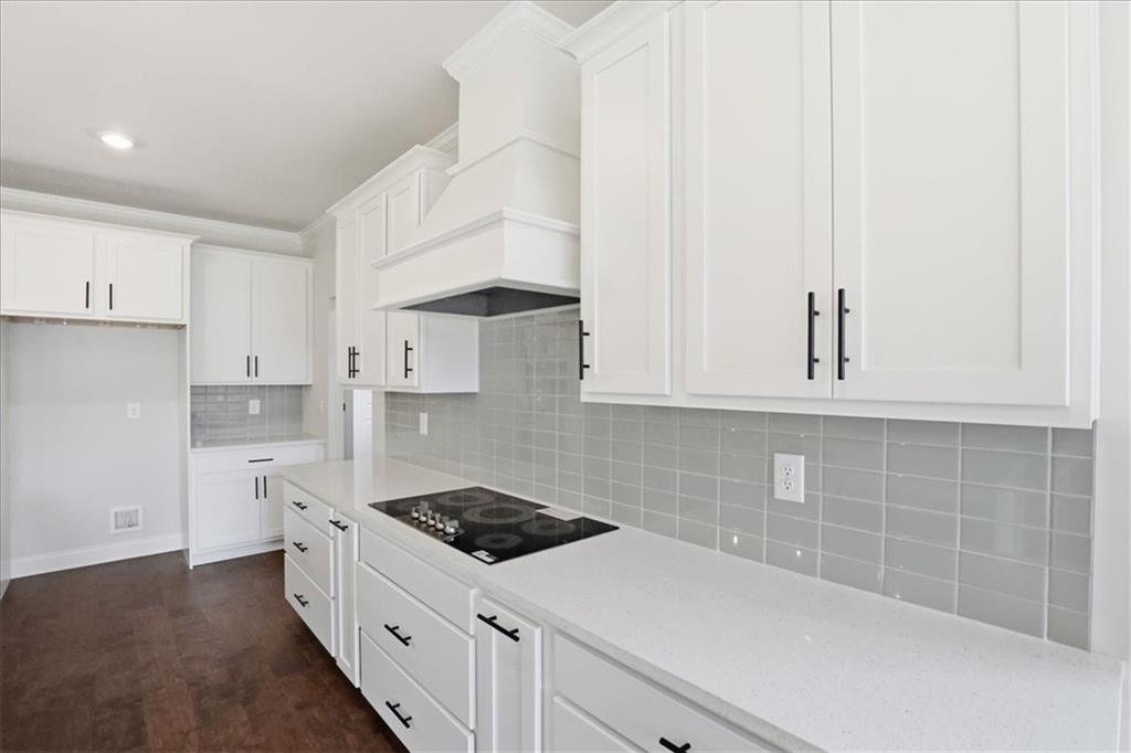 2013 Seclusion Trail Monroe, GA 30656 - Photo 21 of 63 a kitchen with white cabinets and white appliances
