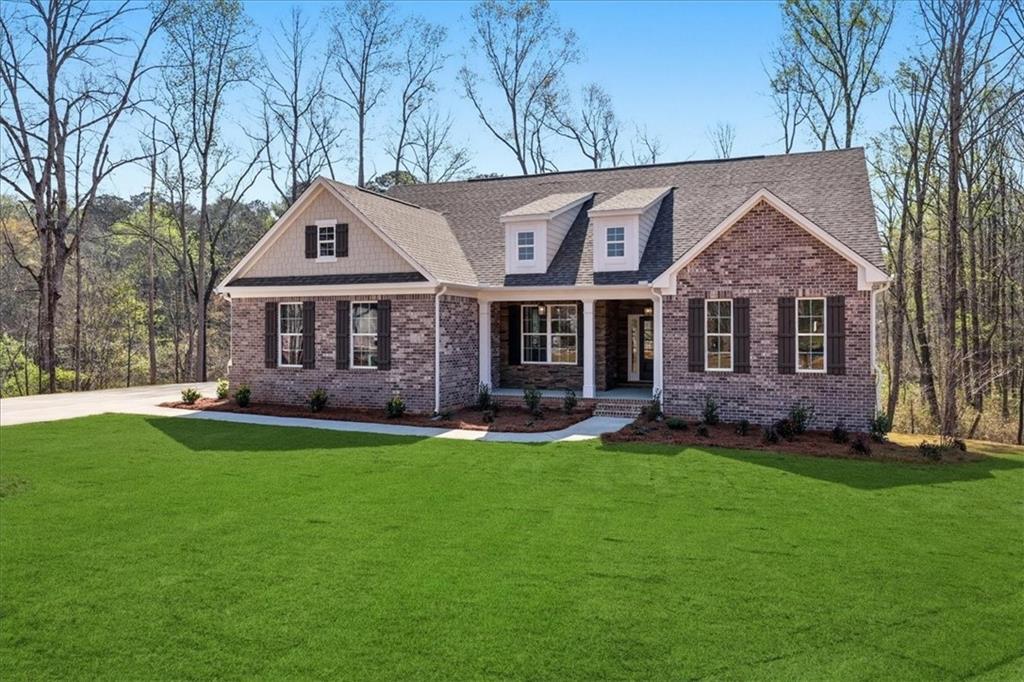 2013 Seclusion Trail Monroe, GA 30656 - Photo 4 of 63 front view of a house with a yard
