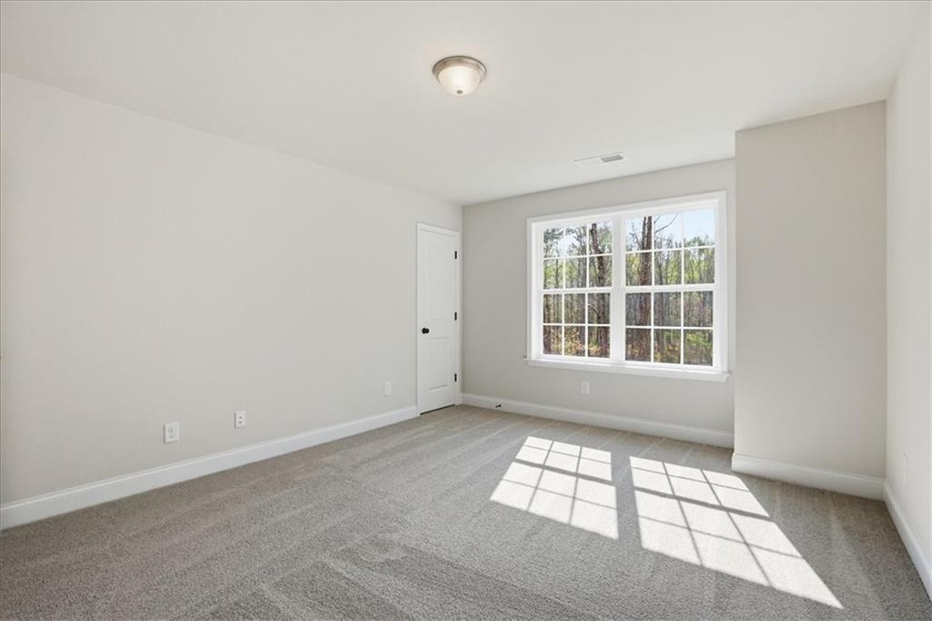 2013 Seclusion Trail Monroe, GA 30656 - Photo 49 of 63 an empty room with windows