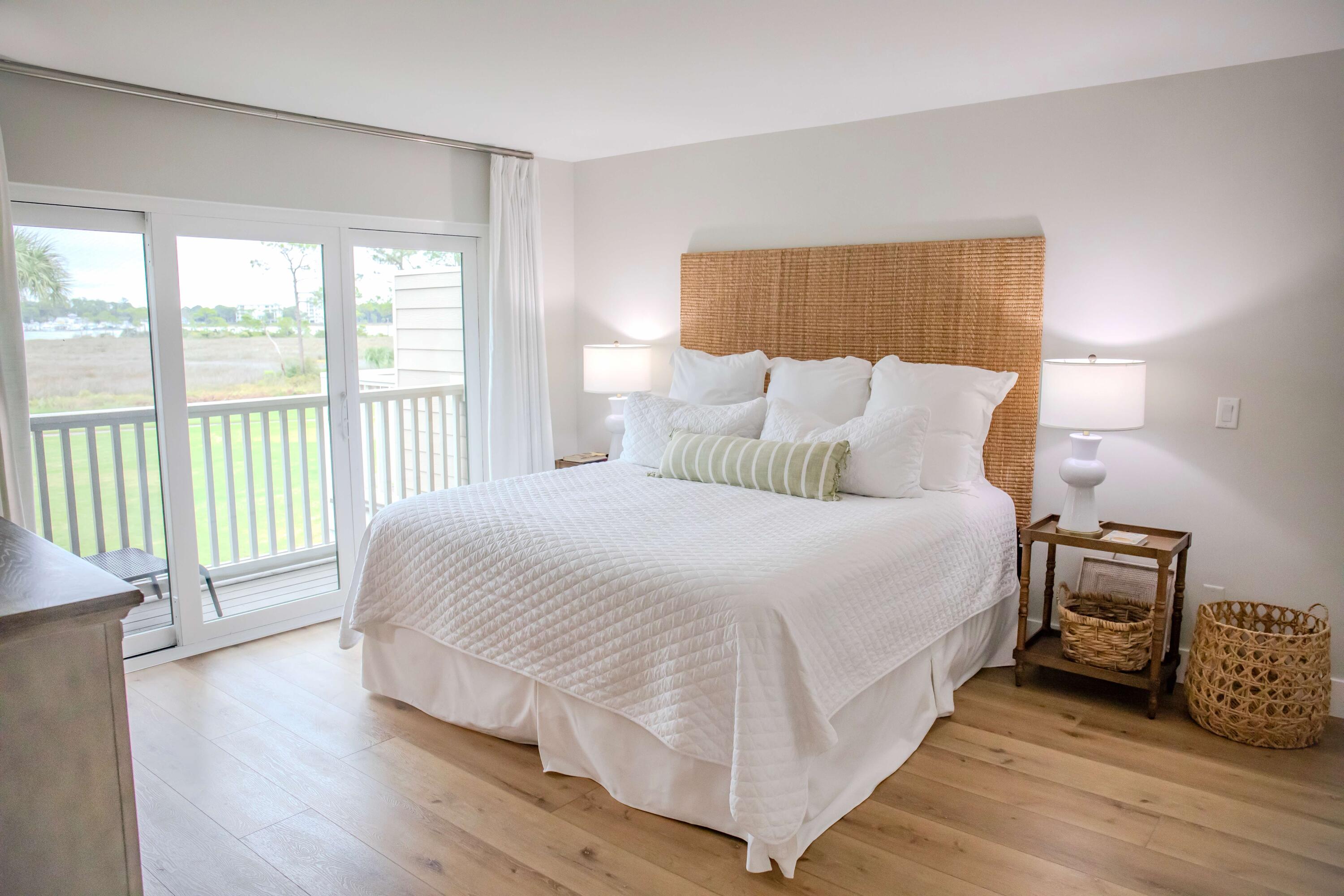 822 Harbour Point Drive, Unit 822 Miramar Beach, FL 32550 - Photo 12 of 41 a large white bed sitting in a bedroom next to a window