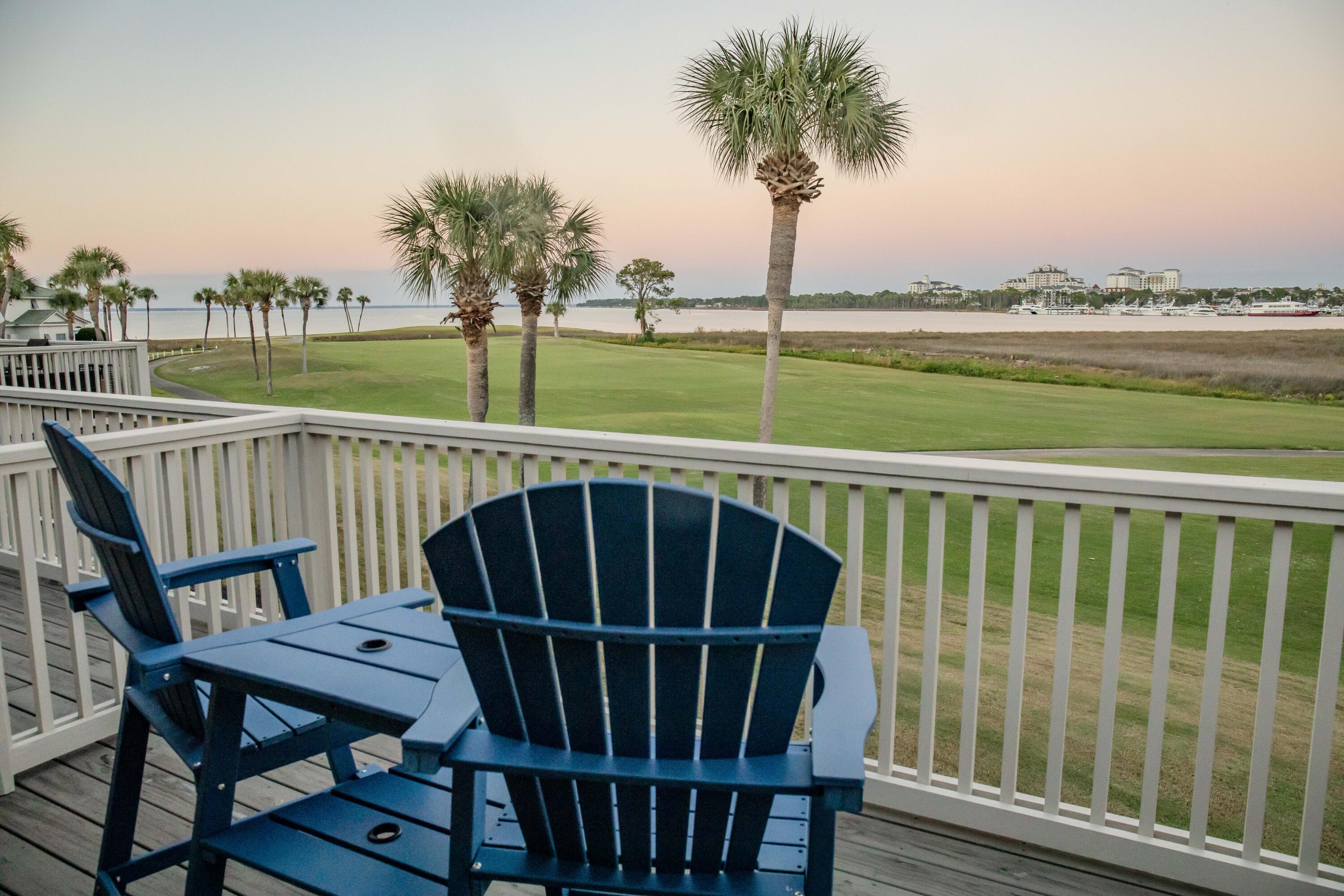 822 Harbour Point Drive, Unit 822 Miramar Beach, FL 32550 - Photo 19 of 41 a view of a roof deck with couches and ocean view