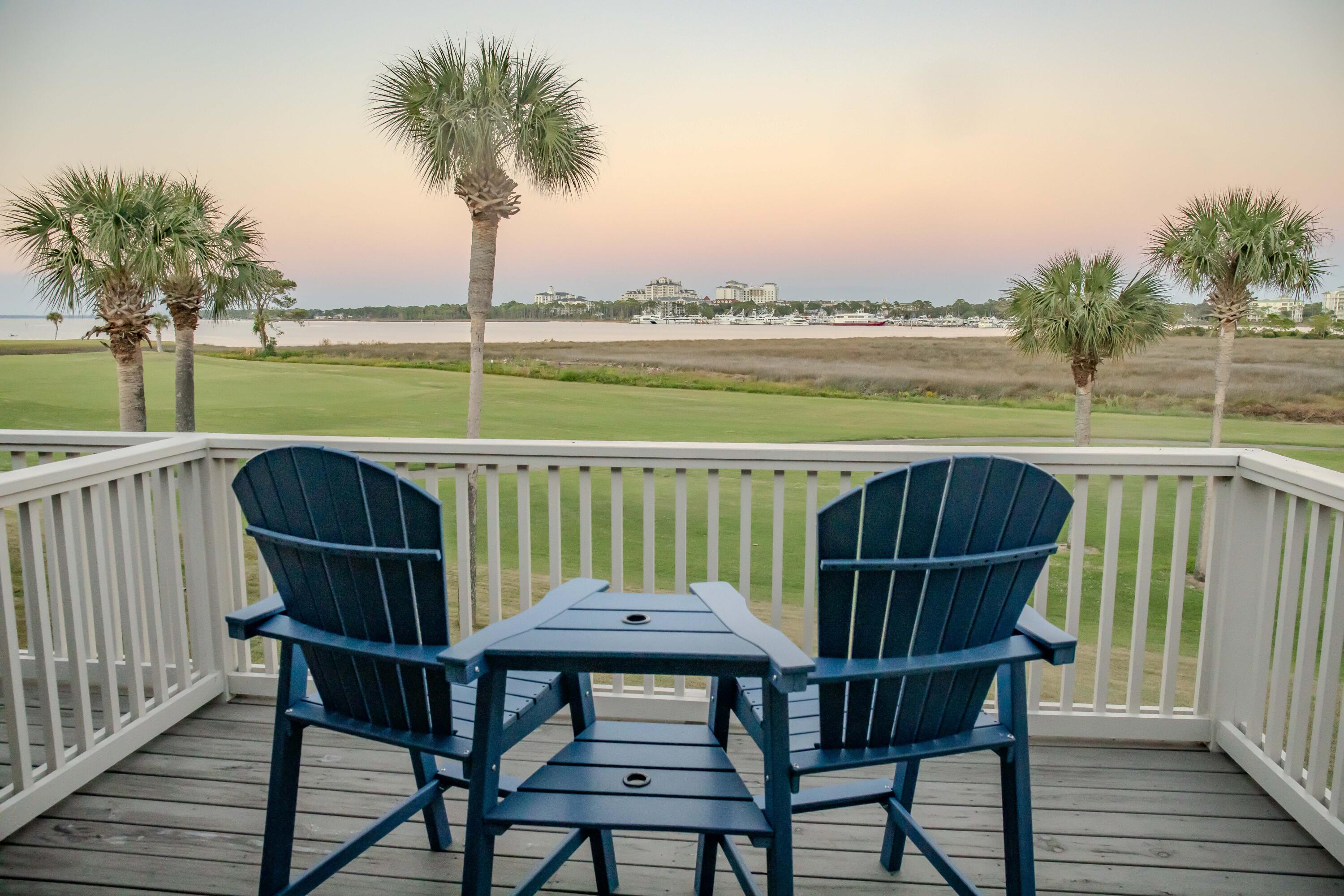 822 Harbour Point Drive, Unit 822 Miramar Beach, FL 32550 - Photo 26 of 41 a balcony with wooden floor outdoor seating and city view