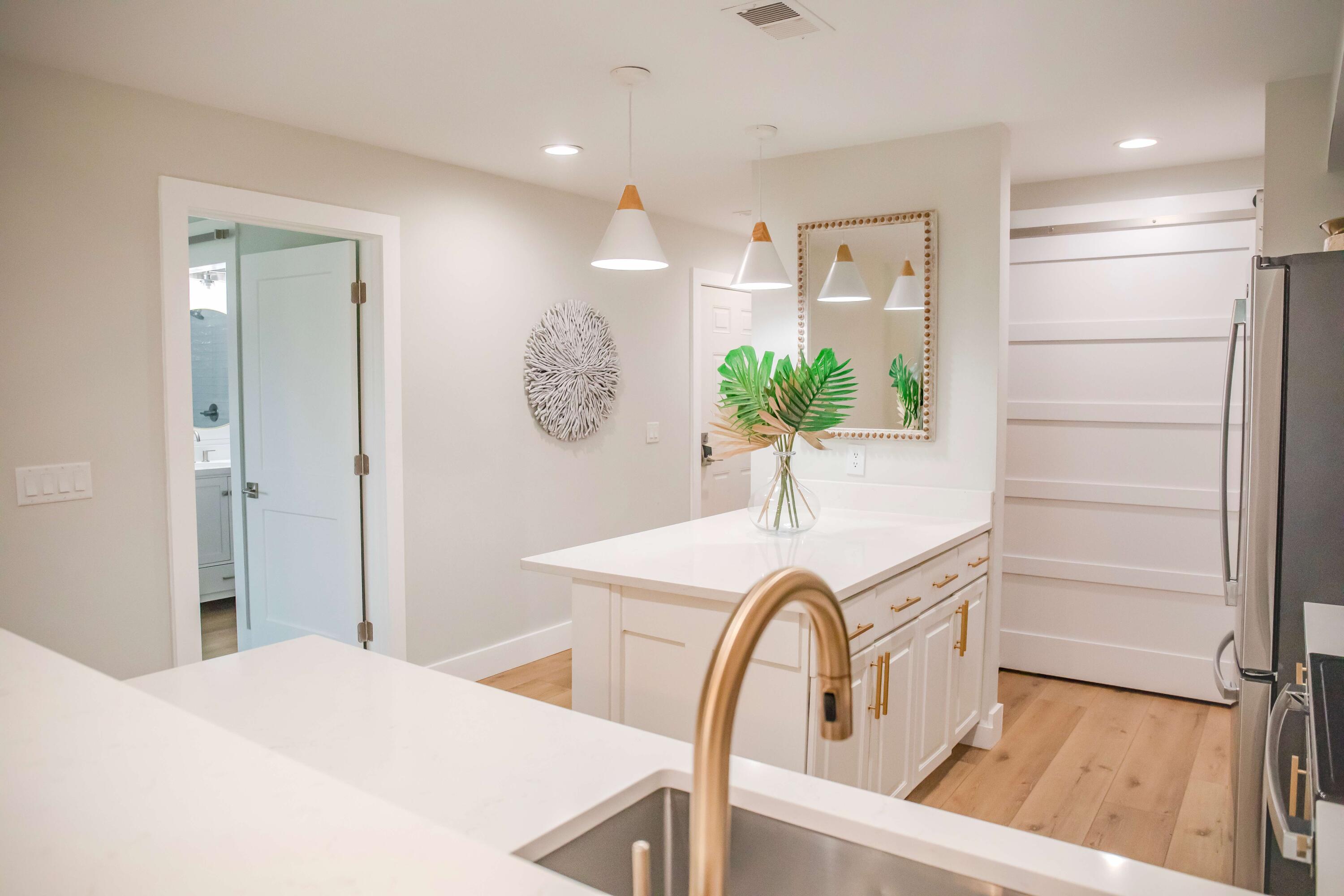 822 Harbour Point Drive, Unit 822 Miramar Beach, FL 32550 - Photo 5 of 41 a kitchen with a refrigerator and a sink
