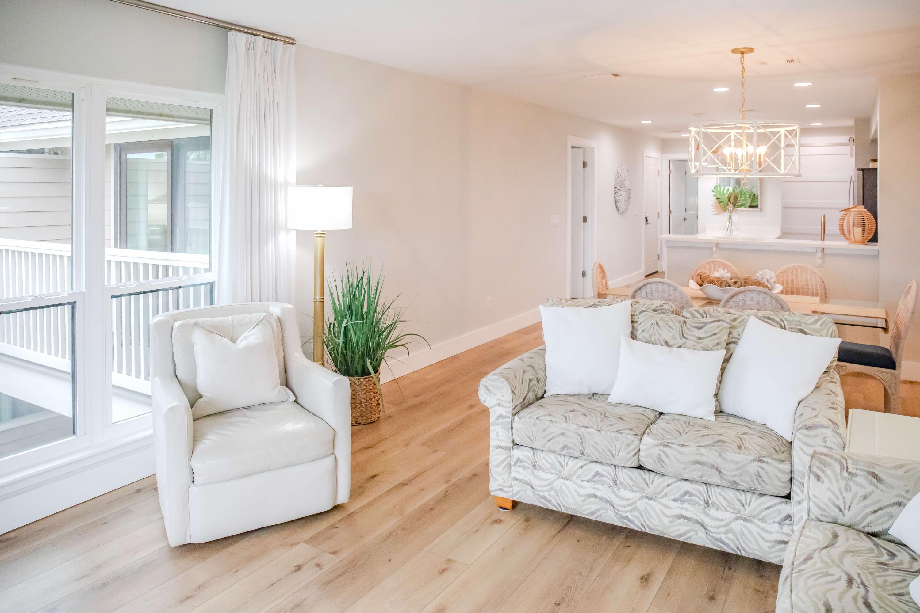 822 Harbour Point Drive, Unit 822 Miramar Beach, FL 32550 - Photo 10 of 41 a living room with furniture and wooden floor