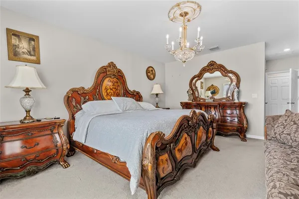 a bedroom with two beds and a table