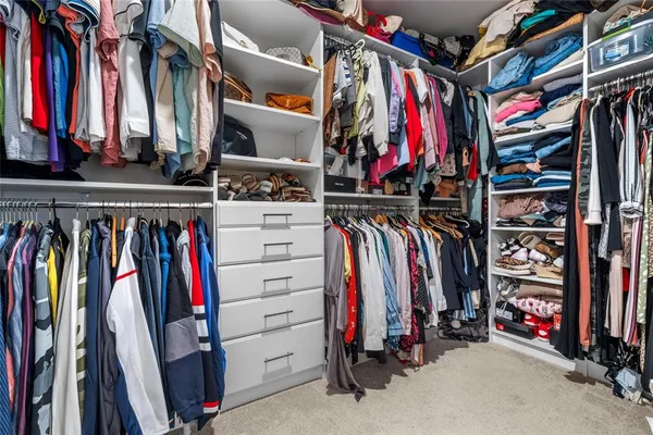 a bathroom with a double vanity sink and mirror