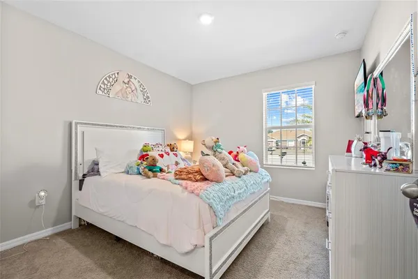 a view of a hallway with wooden shelves