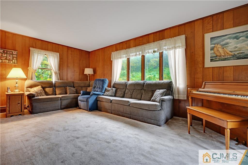 3 Delwood Road Chester, NJ 07930 - Photo 12 of 25 a living room with furniture and a window