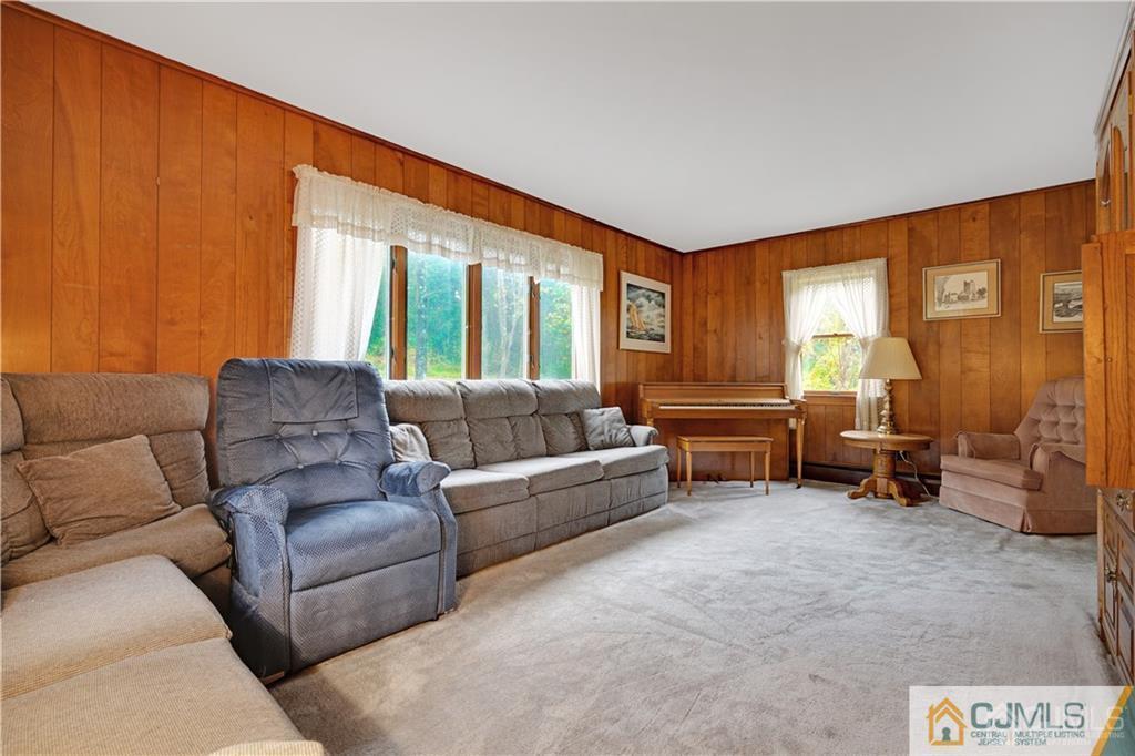 3 Delwood Road Chester, NJ 07930 - Photo 13 of 25 a living room with furniture and a large window