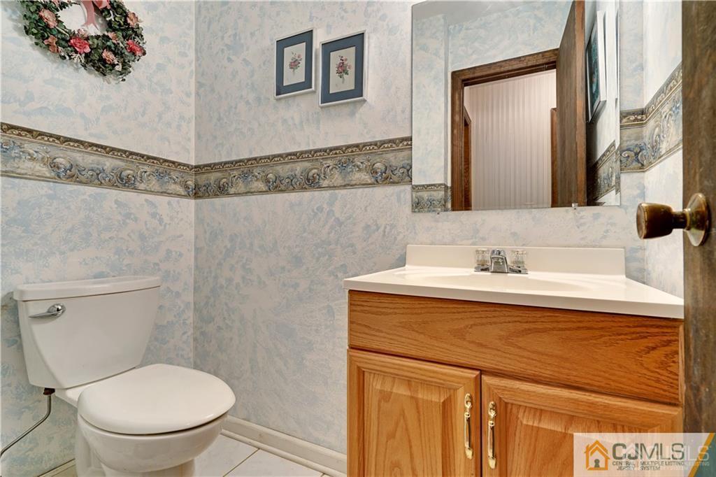 3 Delwood Road Chester, NJ 07930 - Photo 14 of 25 a bathroom with a sink and a toilet