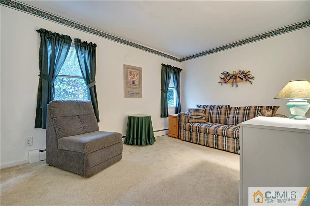 3 Delwood Road Chester, NJ 07930 - Photo 19 of 25 a living room with furniture and a window