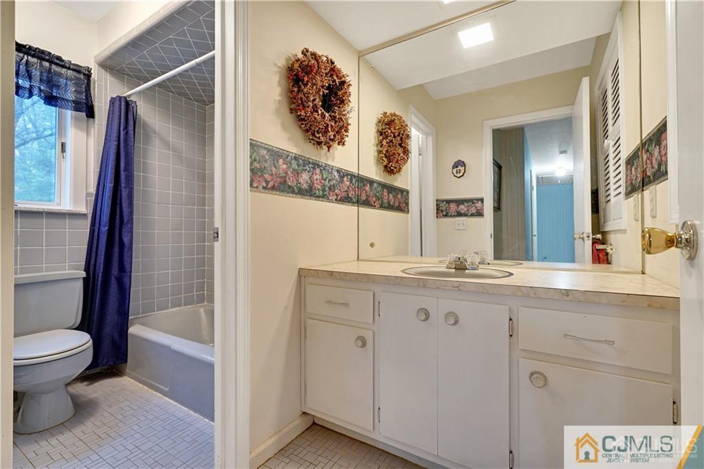 3 Delwood Road Chester, NJ 07930 - Photo 20 of 25 a bathroom with a granite countertop sink toilet and shower