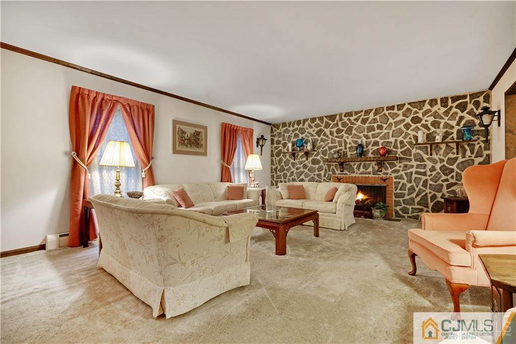 3 Delwood Road Chester, NJ 07930 - Photo 2 of 25 a living room with furniture and a window