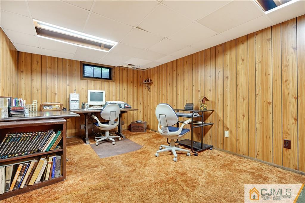 3 Delwood Road Chester, NJ 07930 - Photo 22 of 25 a view of a workspace with furniture and a window