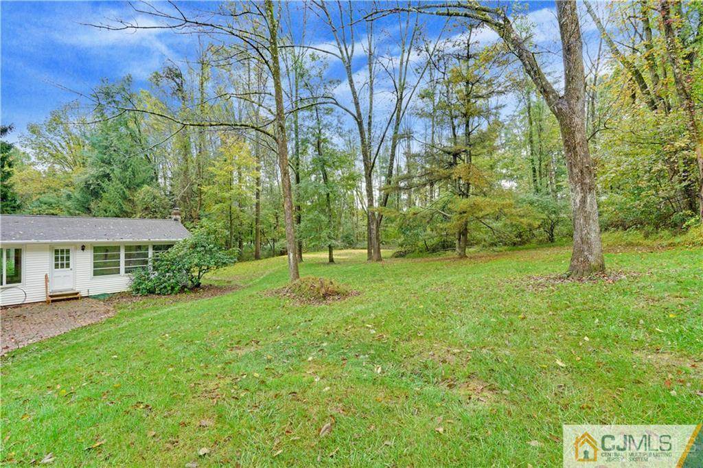 3 Delwood Road Chester, NJ 07930 - Photo 24 of 25 a view of a backyard with a garden