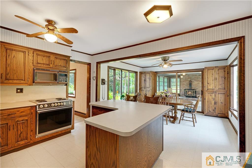 3 Delwood Road Chester, NJ 07930 - Photo 7 of 25 a kitchen with a stove and a refrigerator