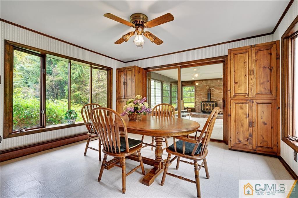 3 Delwood Road Chester, NJ 07930 - Photo 8 of 25 a view of a dining room with furniture window and outside view