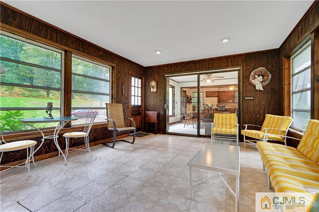 3 Delwood Road Chester, NJ 07930 - Photo 10 of 25 a living room with furniture and large windows
