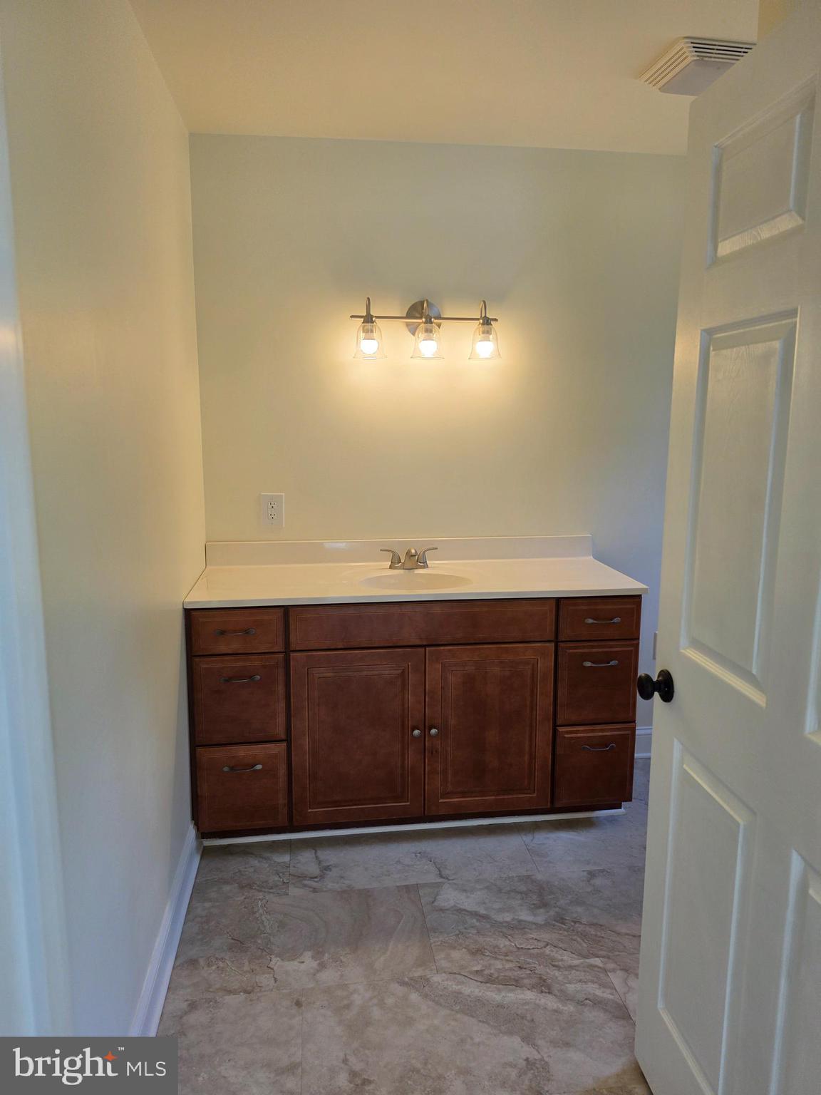 13514 Old Cresaptown Road Southwest Lavale, MD 21502 - Photo 14 of 25 a bathroom with a sink and a mirror