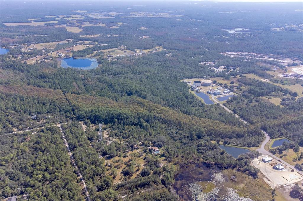 736 Keelhaul Road Osteen, FL 32764 - Photo 11 of 31 an aerial view of house with yard and mountain view in back