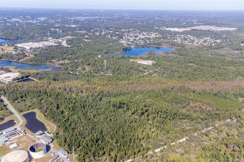 736 Keelhaul Road Osteen, FL 32764 - Photo 18 of 31 an aerial view of residential houses with outdoor space and trees