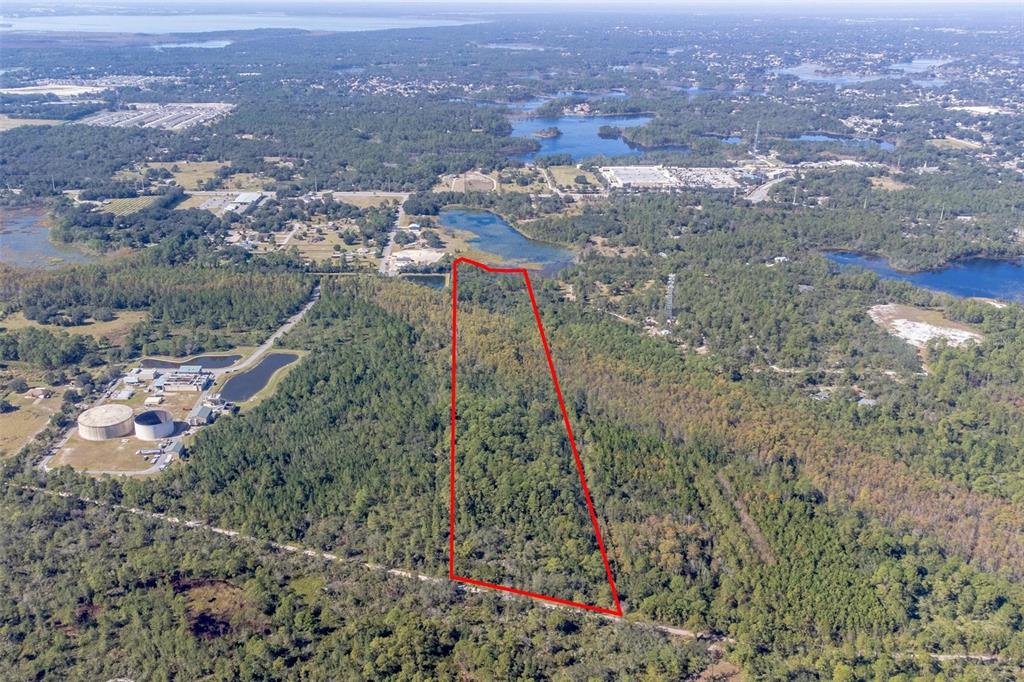 736 Keelhaul Road Osteen, FL 32764 - Photo 25 of 31 an aerial view of residential houses with outdoor space and trees