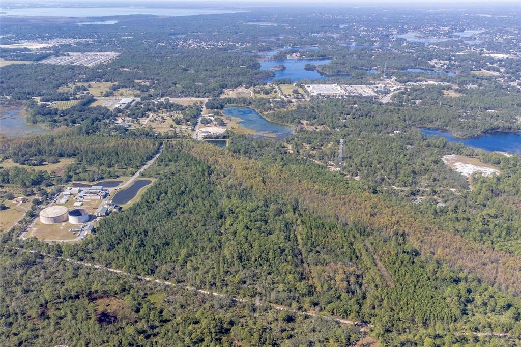 736 Keelhaul Road Osteen, FL 32764 - Photo 7 of 31 an aerial view of house with yard and mountain view in back