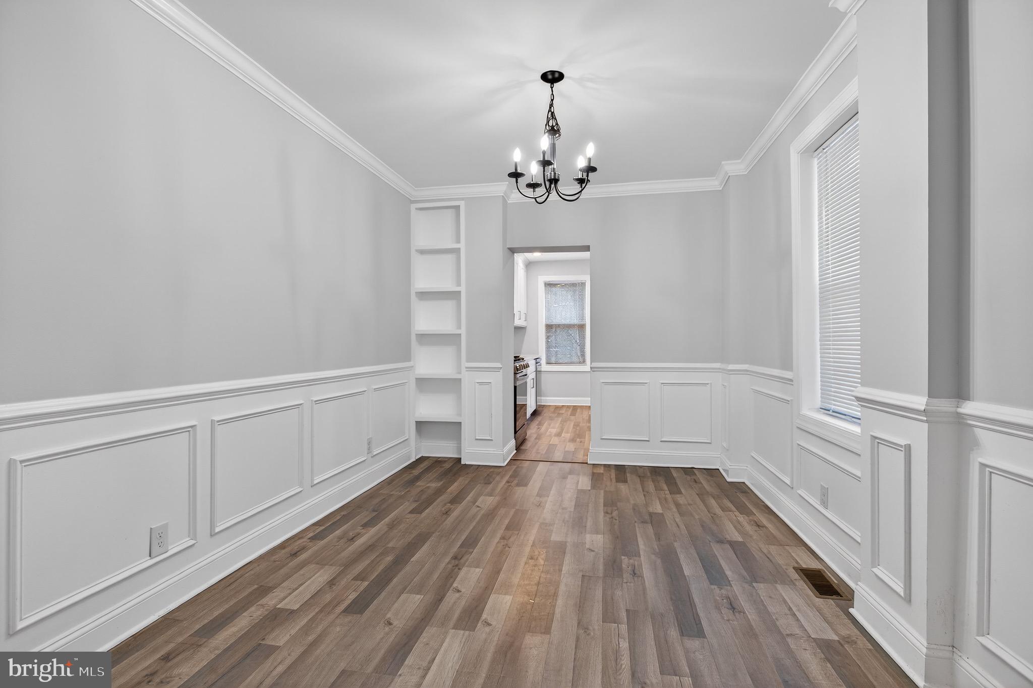39 Carroll Street Trenton, NJ 08608 - Photo 12 of 27 a view of empty room with wooden floor and fan