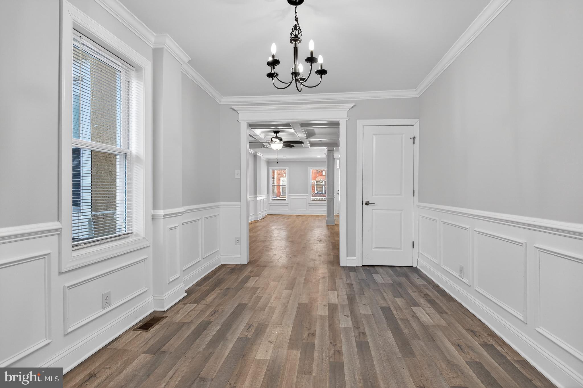 39 Carroll Street Trenton, NJ 08608 - Photo 13 of 27 wooden floor in an empty room with a window
