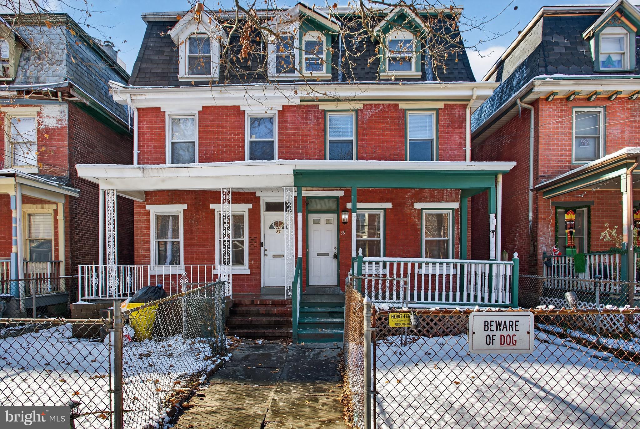39 Carroll Street Trenton, NJ 08608 - Photo 2 of 27 front view of a house with a porch