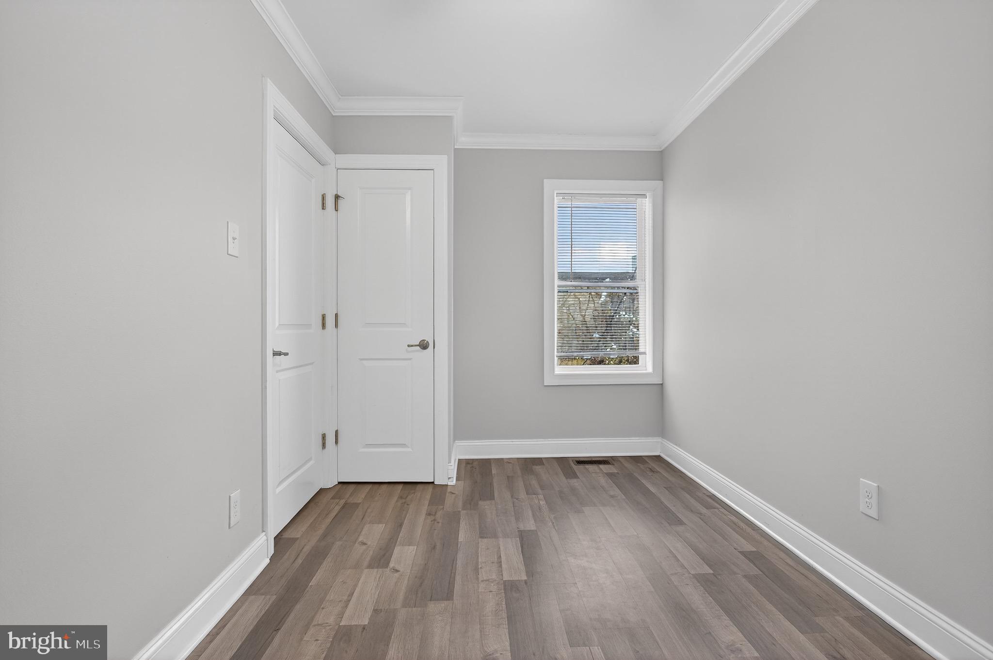 39 Carroll Street Trenton, NJ 08608 - Photo 21 of 27 a view of a room with wooden floor and window