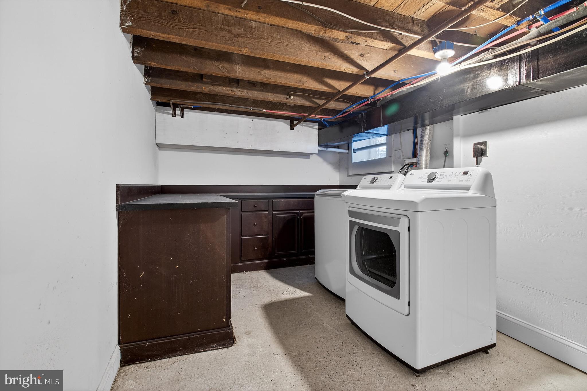 39 Carroll Street Trenton, NJ 08608 - Photo 26 of 27 a utility room with dryer and washer
