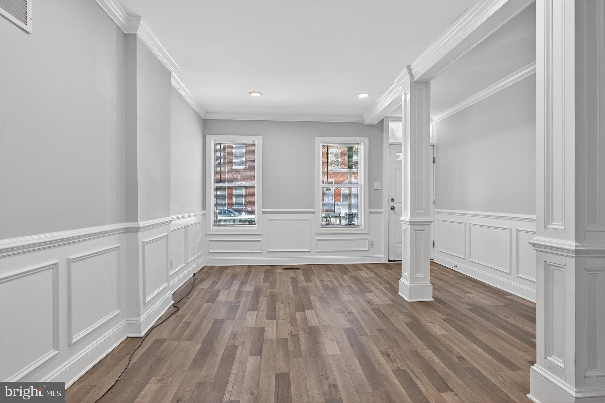 39 Carroll Street Trenton, NJ 08608 - Photo 4 of 27 wooden floor in an empty room with a window