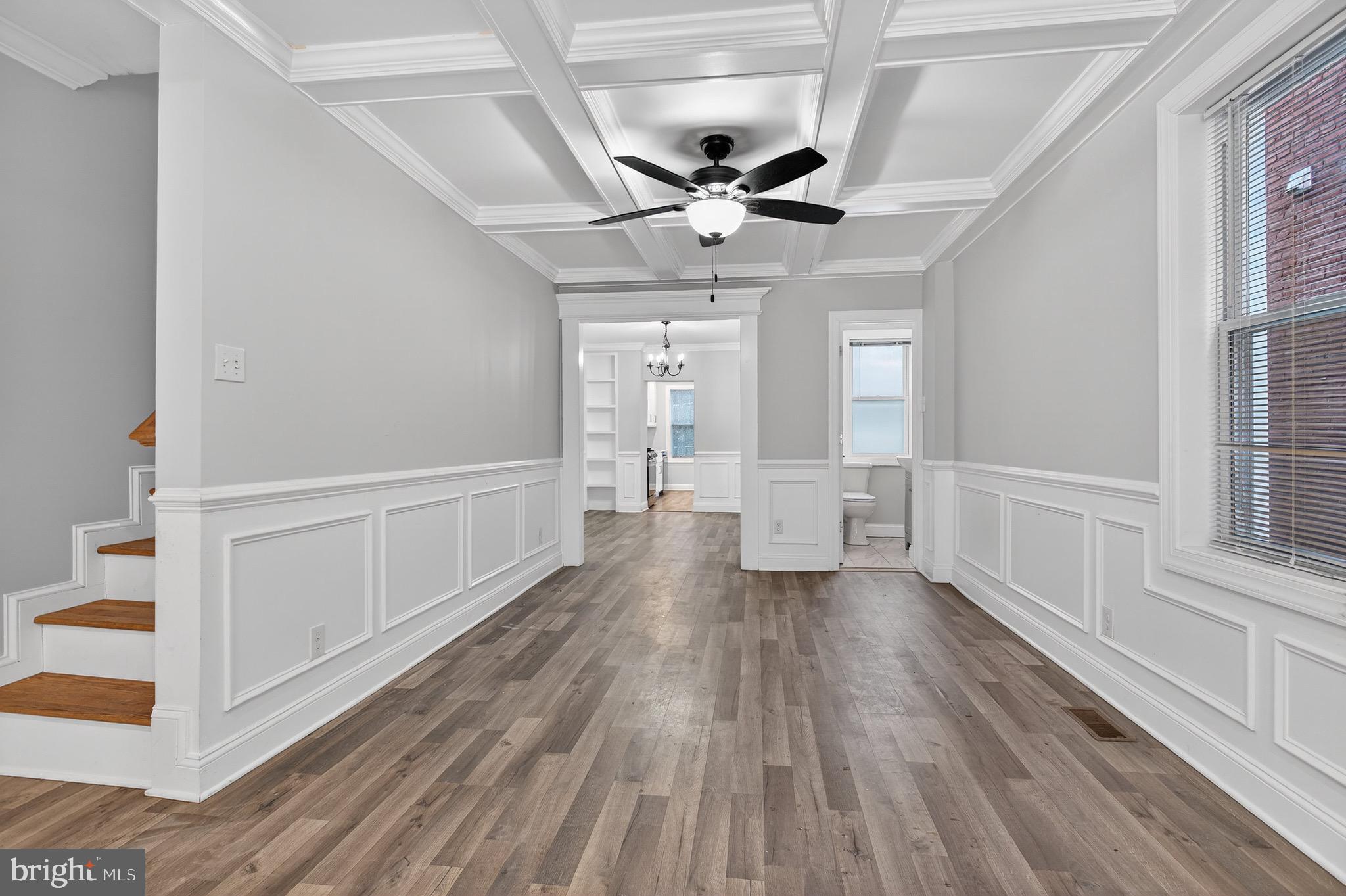 39 Carroll Street Trenton, NJ 08608 - Photo 8 of 27 a view of an empty room and window with wooden floor